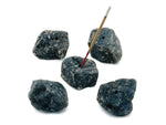 Handmade Labradorite rough crystal incense holder with carved design, perfect for holding incense sticks in a natural gemstone display.