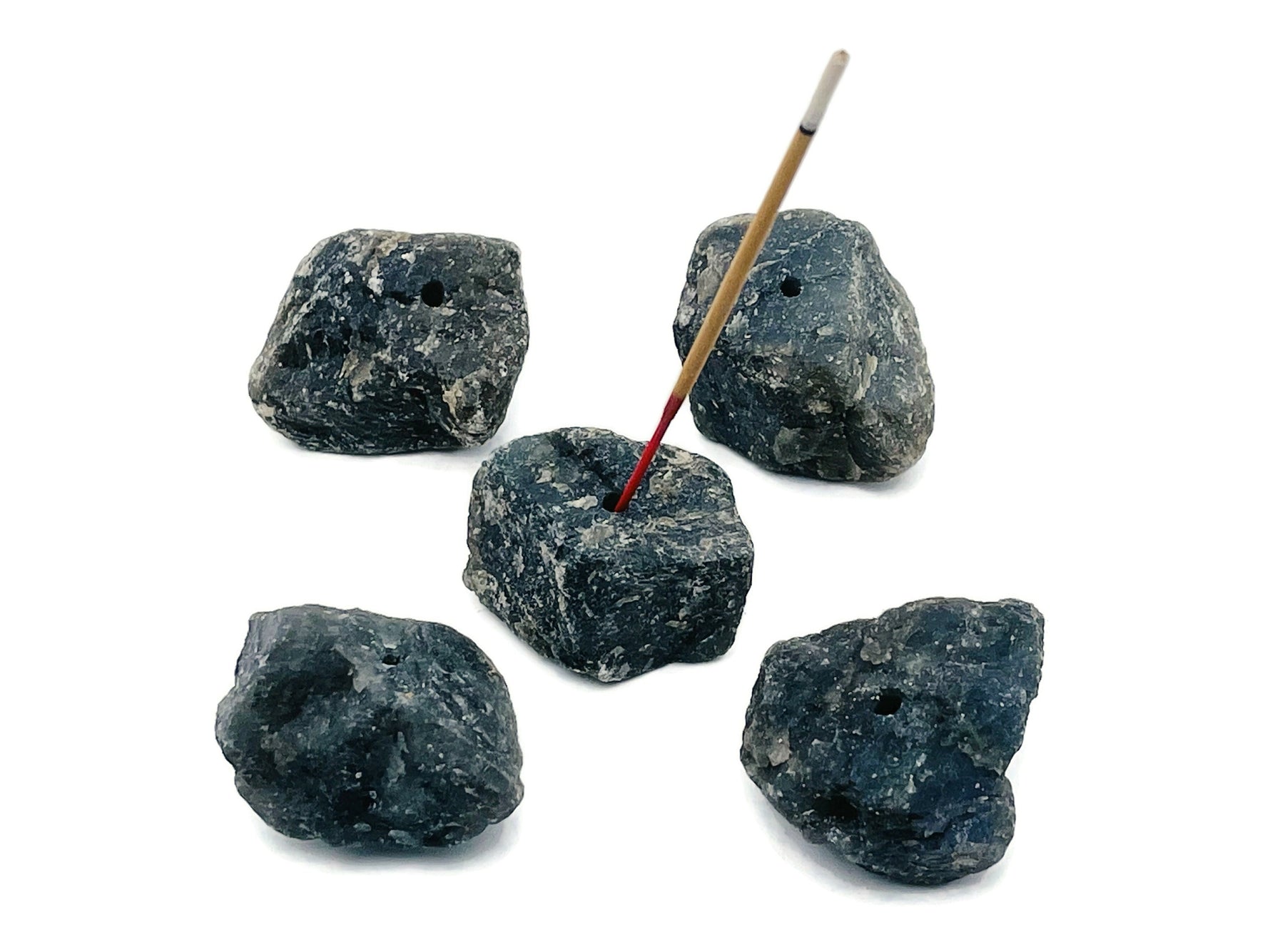 Handmade Labradorite rough crystal incense holder with carved design, perfect for holding incense sticks in a natural gemstone display.