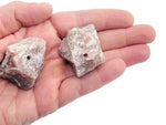Handmade strawberry quartz rough crystal incense holder with carved design, perfect for holding incense sticks.