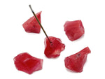 Handmade cherry quartz rough crystal incense holder with carved design, perfect for holding incense sticks in a natural setting.