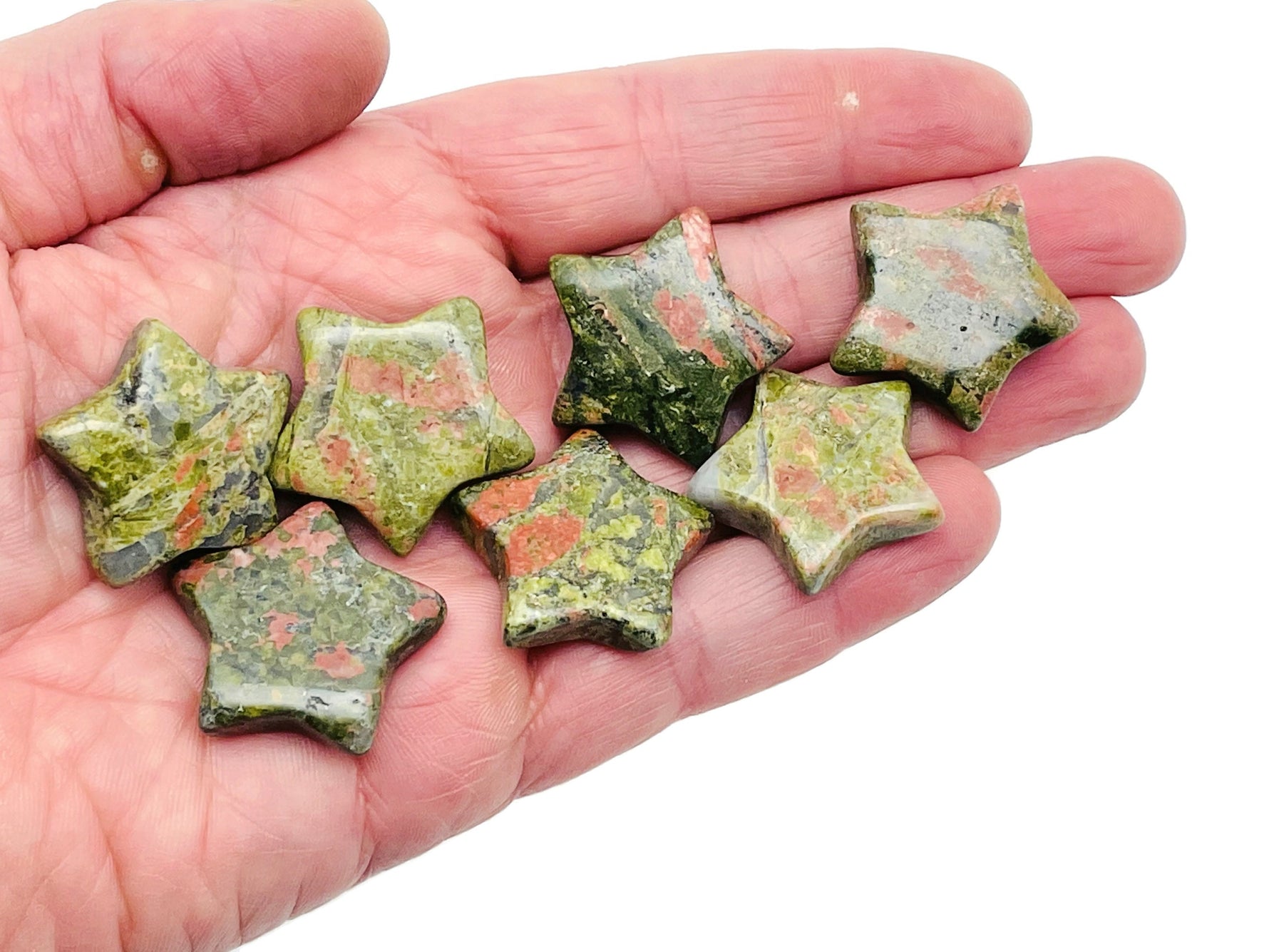 Unakite star-shaped gemstone, 30mm, from GemstoneGO, showcasing a vibrant green and pink mineral pattern.