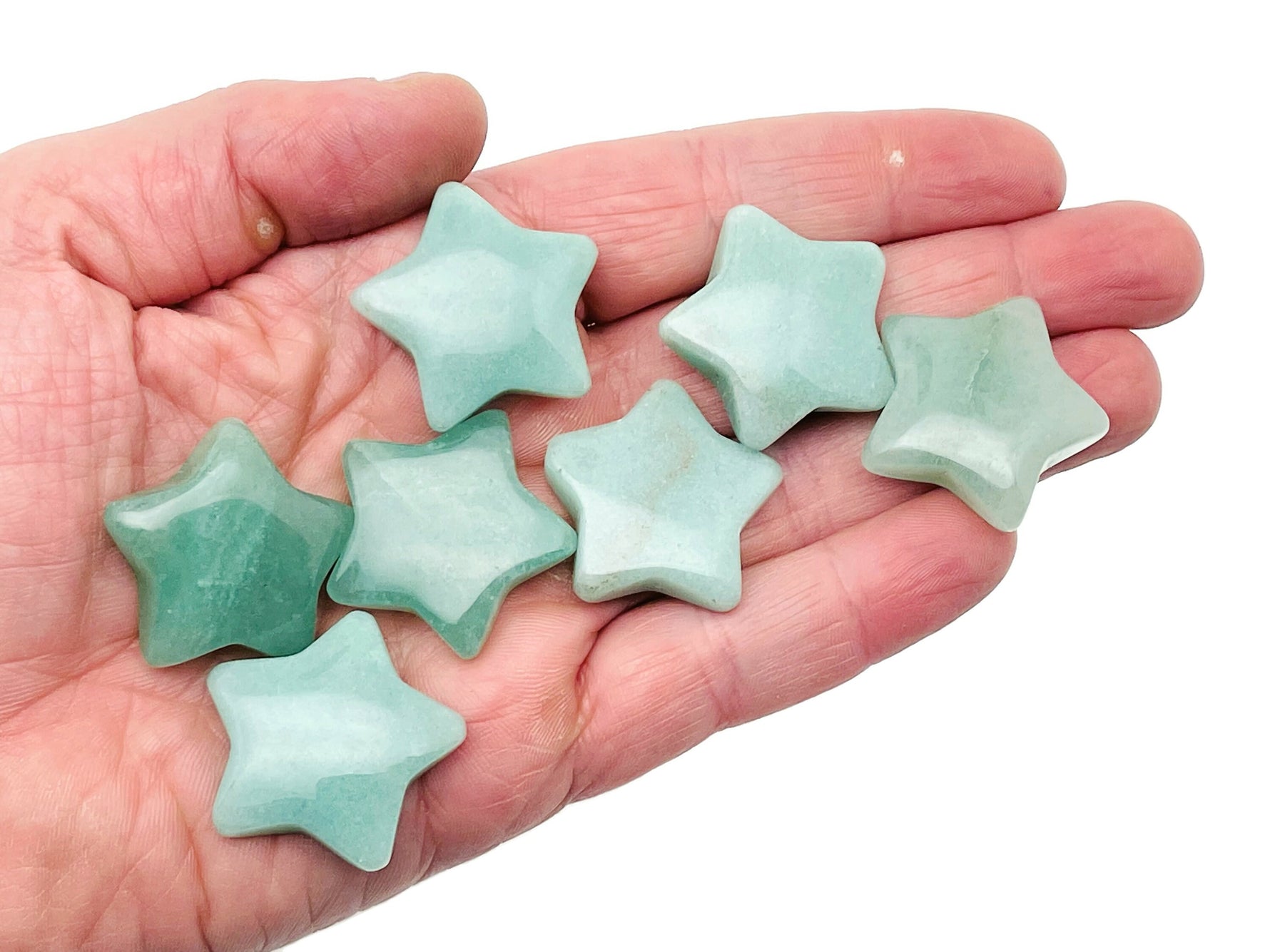 A 30mm Aventurine star gemstone from GemstoneGO, showing a polished green stone with a star-shaped pattern and natural gemstone features.