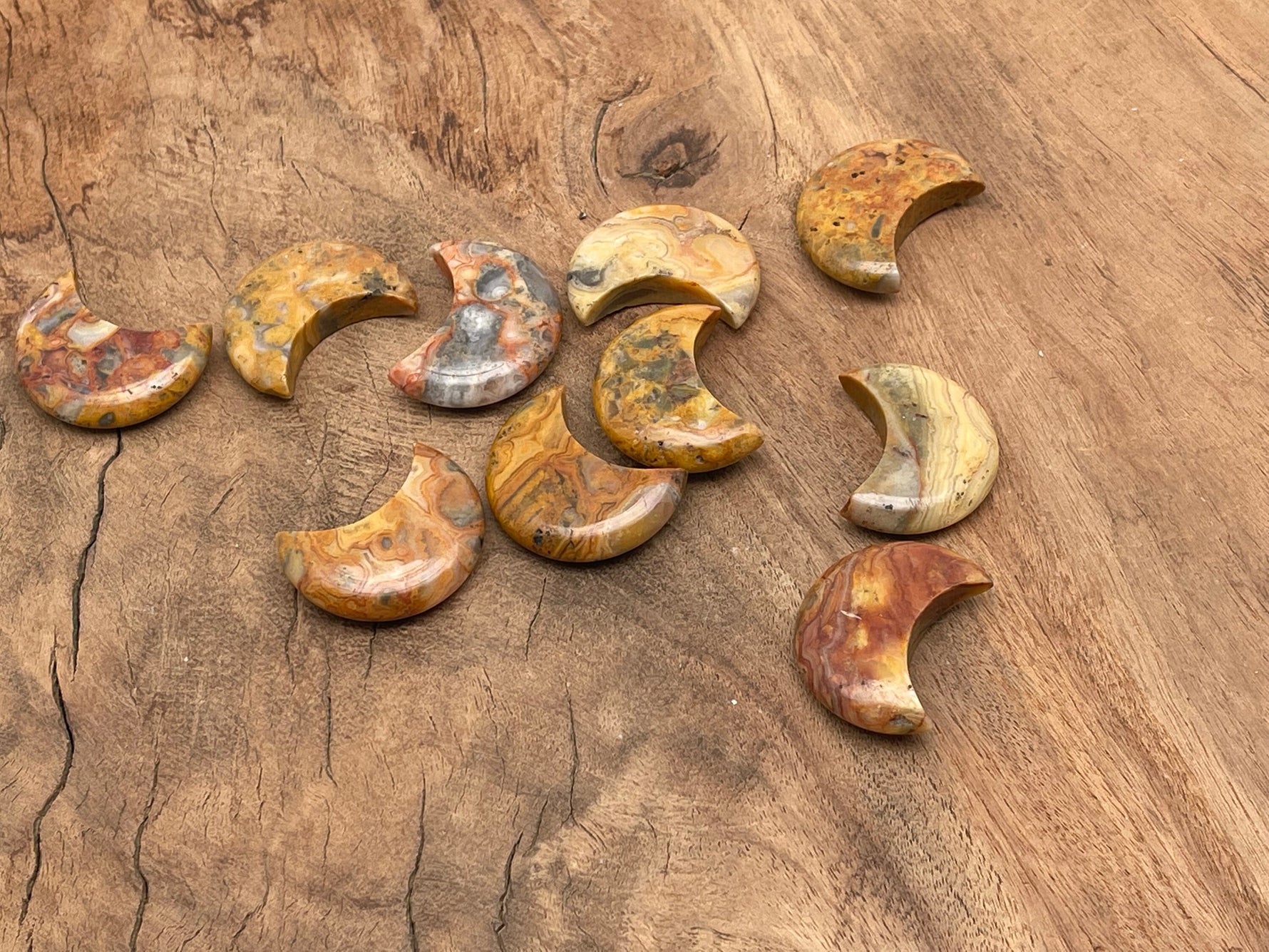 30mm Crazy Lace Agate gemstone moon pendant from GemstoneGO, featuring intricate lace-like patterns and a polished finish.