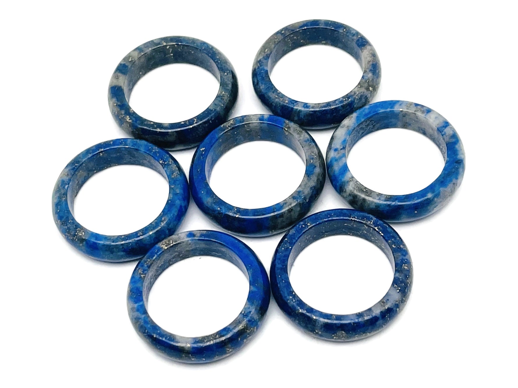 Lapis Lazuli crystal ring by GemstoneGO featuring a deep blue gemstone set in a silver band, showcasing intricate jewelry design.