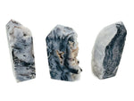 Sphalerite obelisk tower crystal from GemstoneGO, featuring a dark, polished mineral with natural striations and a pointed top.