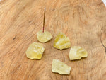 Handmade citrine rough crystal incense holder with carved design, ideal for holding incense sticks in a natural gemstone display.