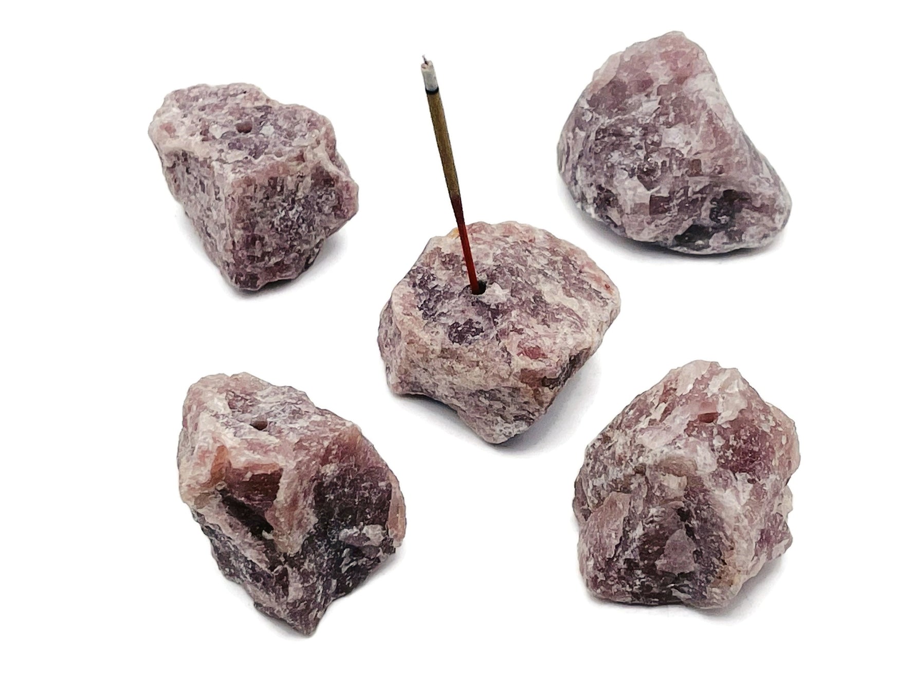Handmade strawberry quartz rough crystal incense holder with carved design, perfect for holding incense sticks.