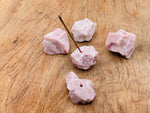 Handmade pink opal rough crystal incense holder with carved design, ideal for holding incense sticks and adding natural elegance.