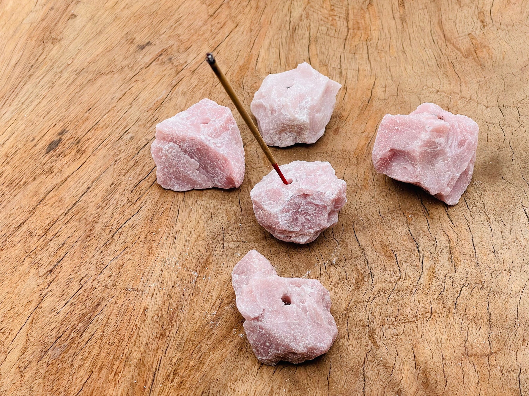 Handmade pink opal rough crystal incense holder with carved design, ideal for holding incense sticks and adding natural elegance.