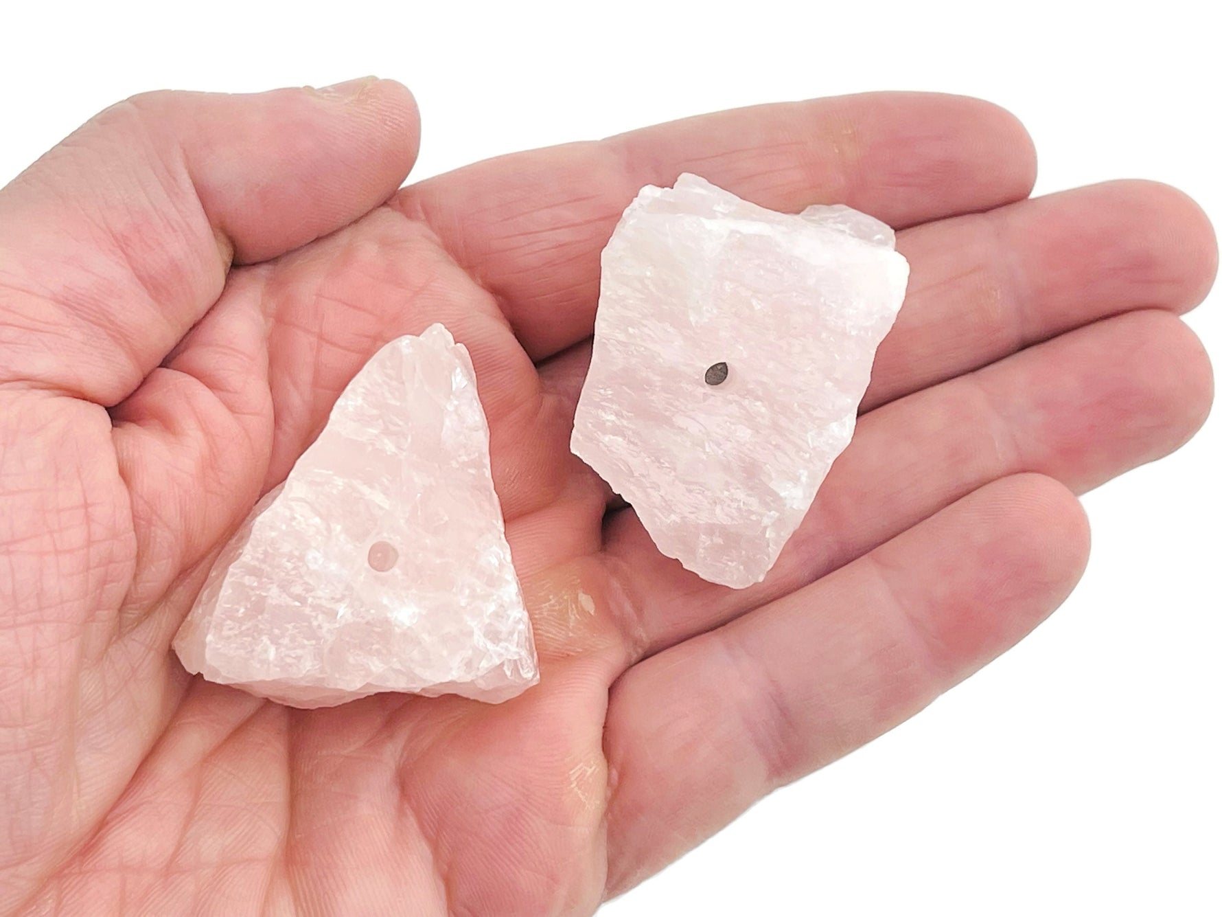 Handmade rose quartz rough crystal incense holder with carved design, ideal for holding incense sticks and enhancing spiritual ambiance.