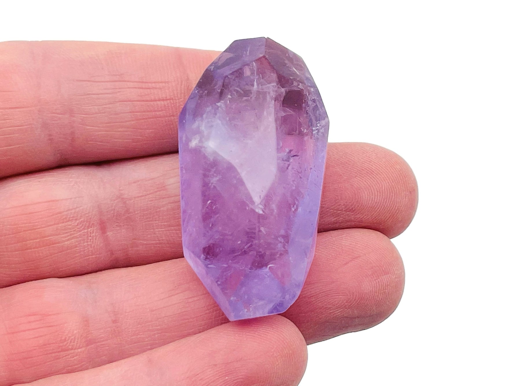 Amethyst double obelisk tower crystal from GemstoneGO, showing purple gemstone with natural crystal facets and pointed top.