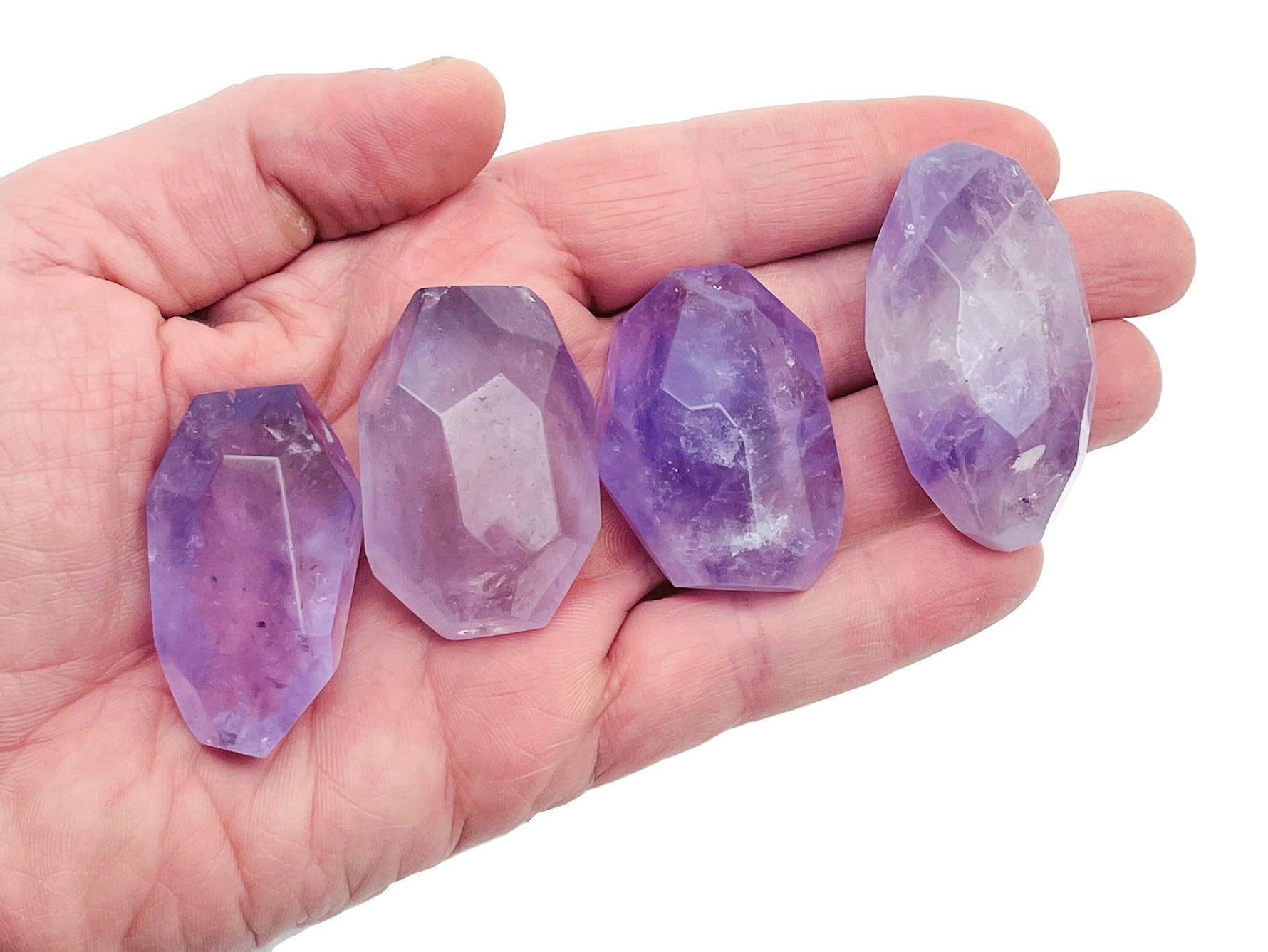 Amethyst double obelisk tower crystal from GemstoneGO, featuring purple gemstone with natural stone texture and pointed top.