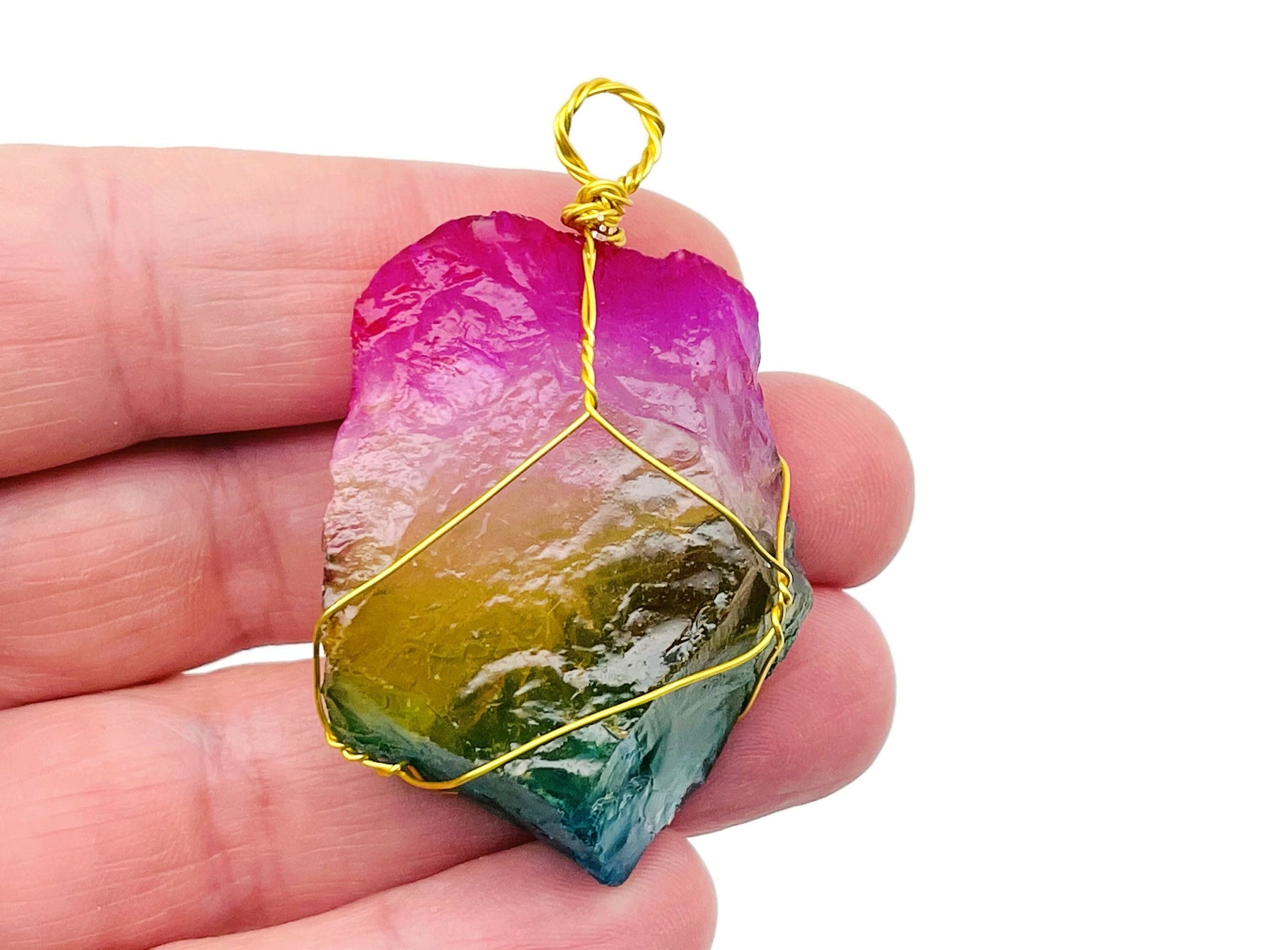 Rainbow Aura Quartz gemstone pendant wrapped in brass wire, showcasing vibrant colors and intricate wire wrapping design.