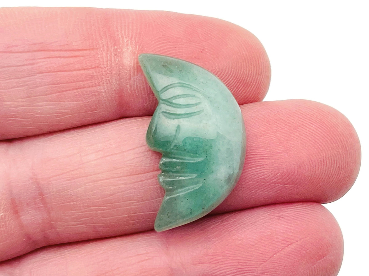 A 25mm aventurine crystal moon face pendant with a smiling expression, handcrafted gemstone from GemstoneGO.