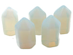 Opalite obelisk tower crystal from GemstoneGO, 25mm, showcasing a smooth, translucent white gemstone with subtle blue glow.