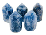 Blue Spot Jasper obelisk tower crystal from GemstoneGO showcasing a polished blue and brown gemstone sculpture.