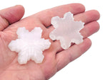 Selenite flower carving gemstone from GemstoneGO showcasing a detailed, polished flower shape in translucent white selenite.