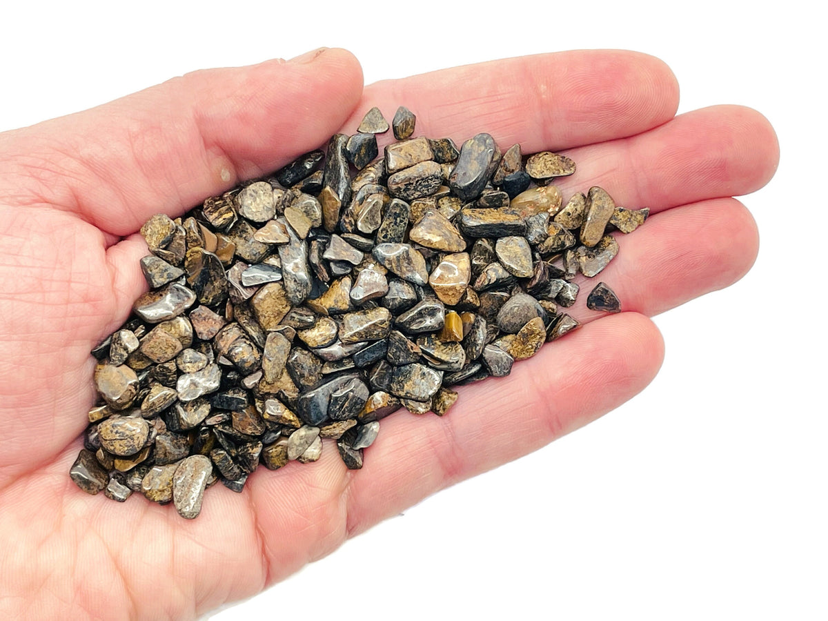 Bronzite crystal chips, semi-tumbled 5-7mm gemstones, from GemstoneGO, shown in bulk with warm bronze tones.