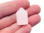 Rose Quartz gemstone, 25mm round polished stone from GemstoneGO, showcasing its soft pink color and smooth surface.
