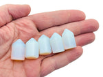 Opalite obelisk tower crystal, 25mm, from GemstoneGO, showcasing a smooth, translucent gemstone with a pointed obelisk shape.