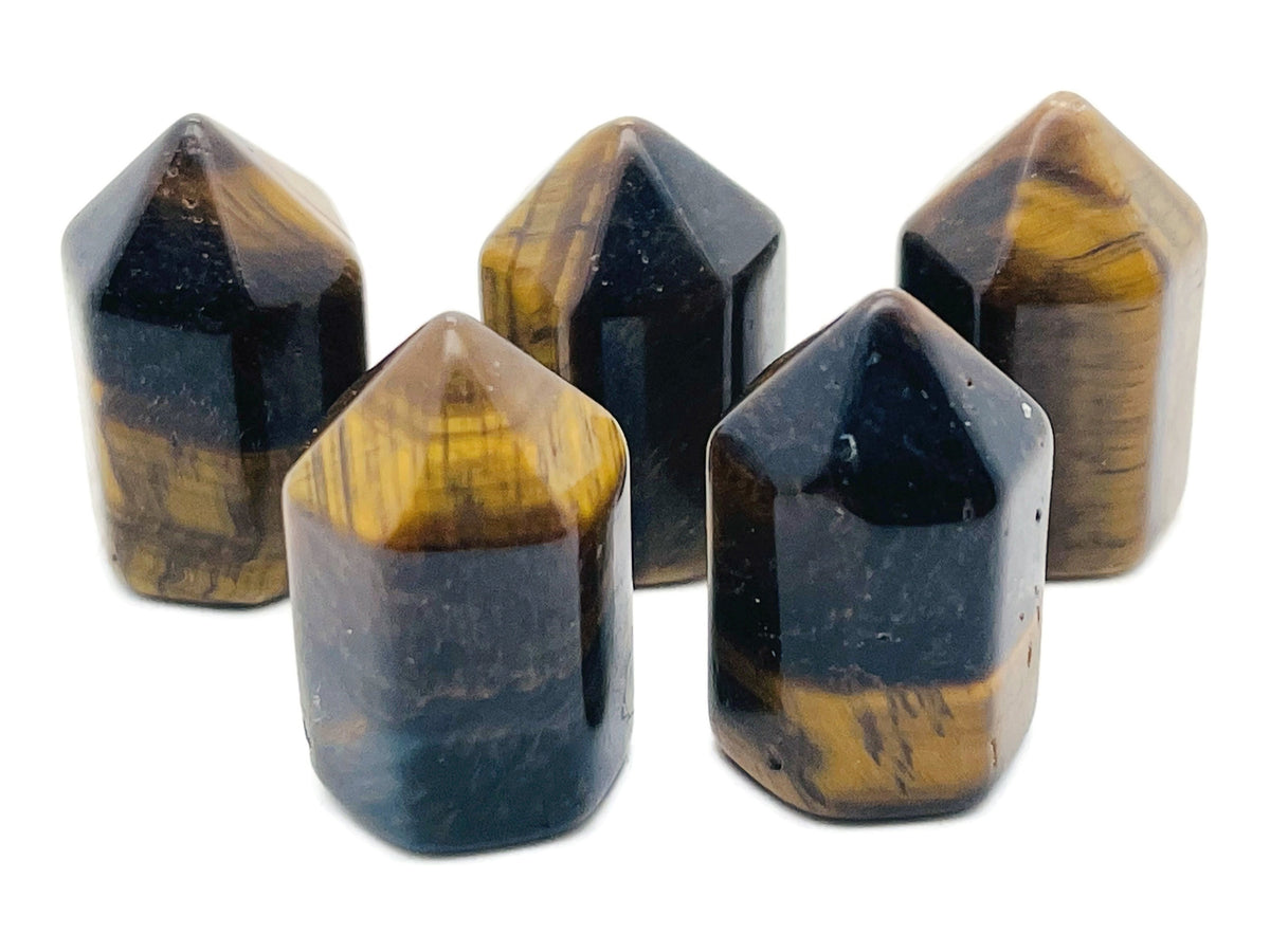Tiger Eye obelisk tower crystal from GemstoneGO, 25mm gemstone with rich golden-brown bands and smooth polished surface.