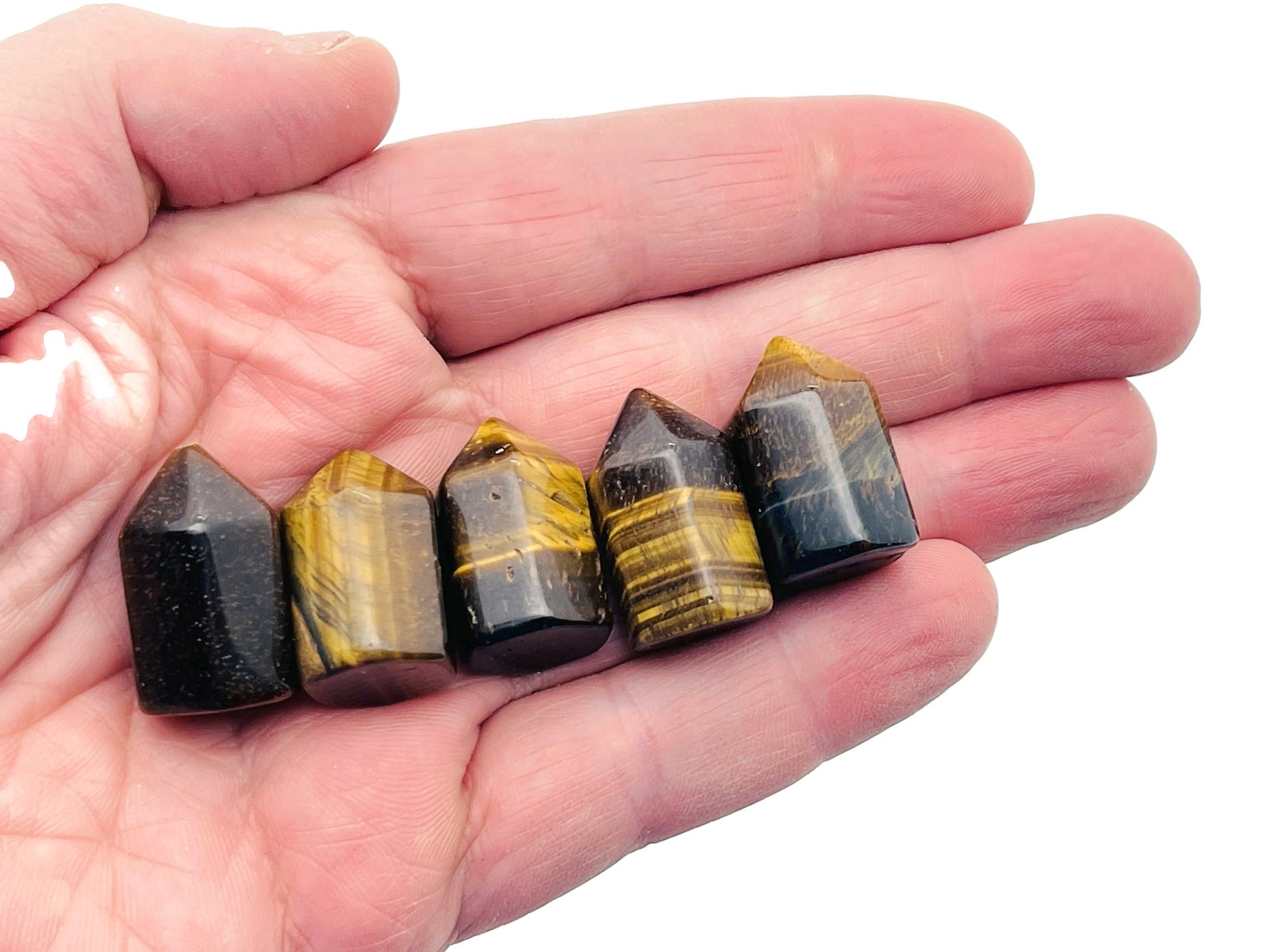 Tiger Eye obelisk tower crystal from GemstoneGO, 25mm, showcasing polished, golden-brown stone with natural banding and smooth finish.