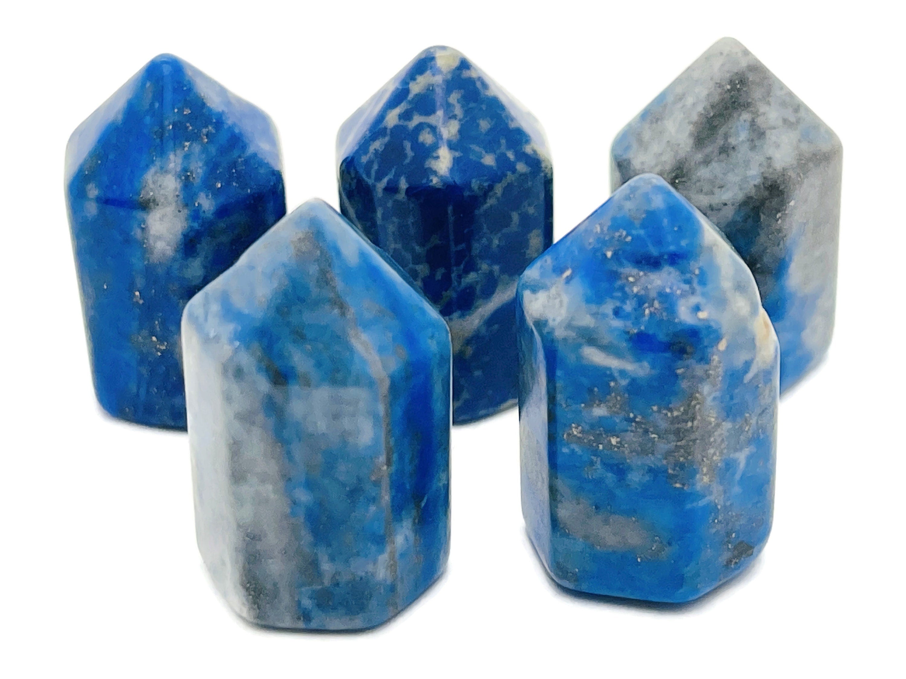 Lapis Lazuli obelisk tower crystal, 25mm, from GemstoneGO, showing deep blue stone with gold flecks and polished surface.
