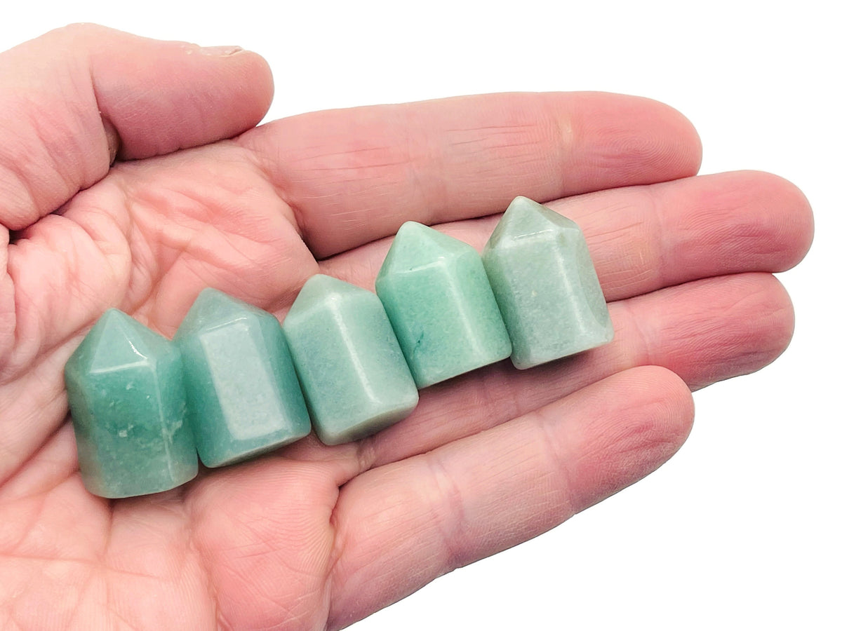 Aventurine obelisk tower crystal from GemstoneGO, 25mm tall with a smooth polished green gemstone surface.
