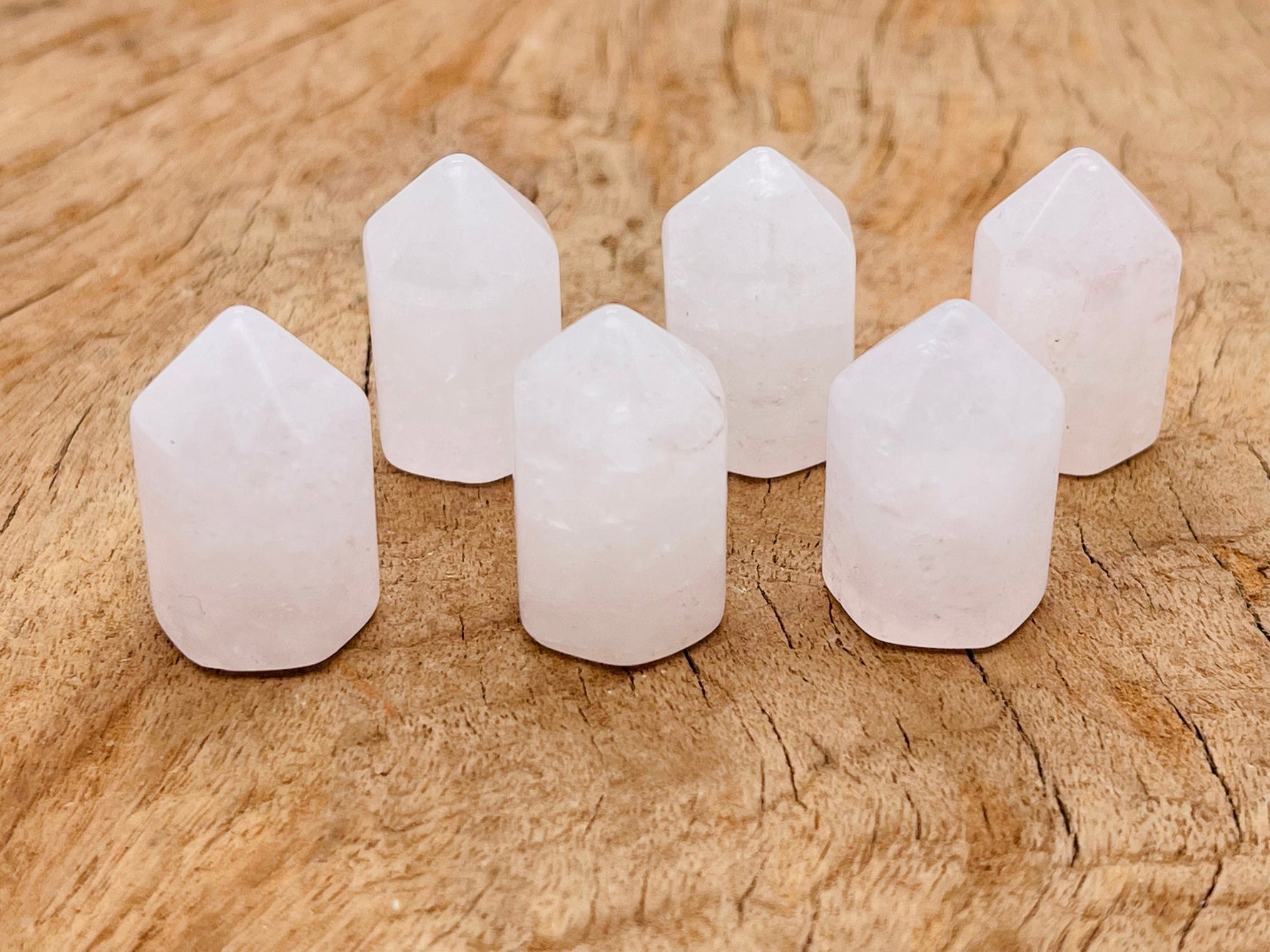 Clear Quartz obelisk tower crystal from GemstoneGO, 25mm, showcasing a polished, transparent gemstone with natural clarity and facets.