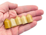 Yellow aventurine obelisk tower crystal from GemstoneGO, 25mm, smooth polished gemstone with pointed top and vibrant yellow color.