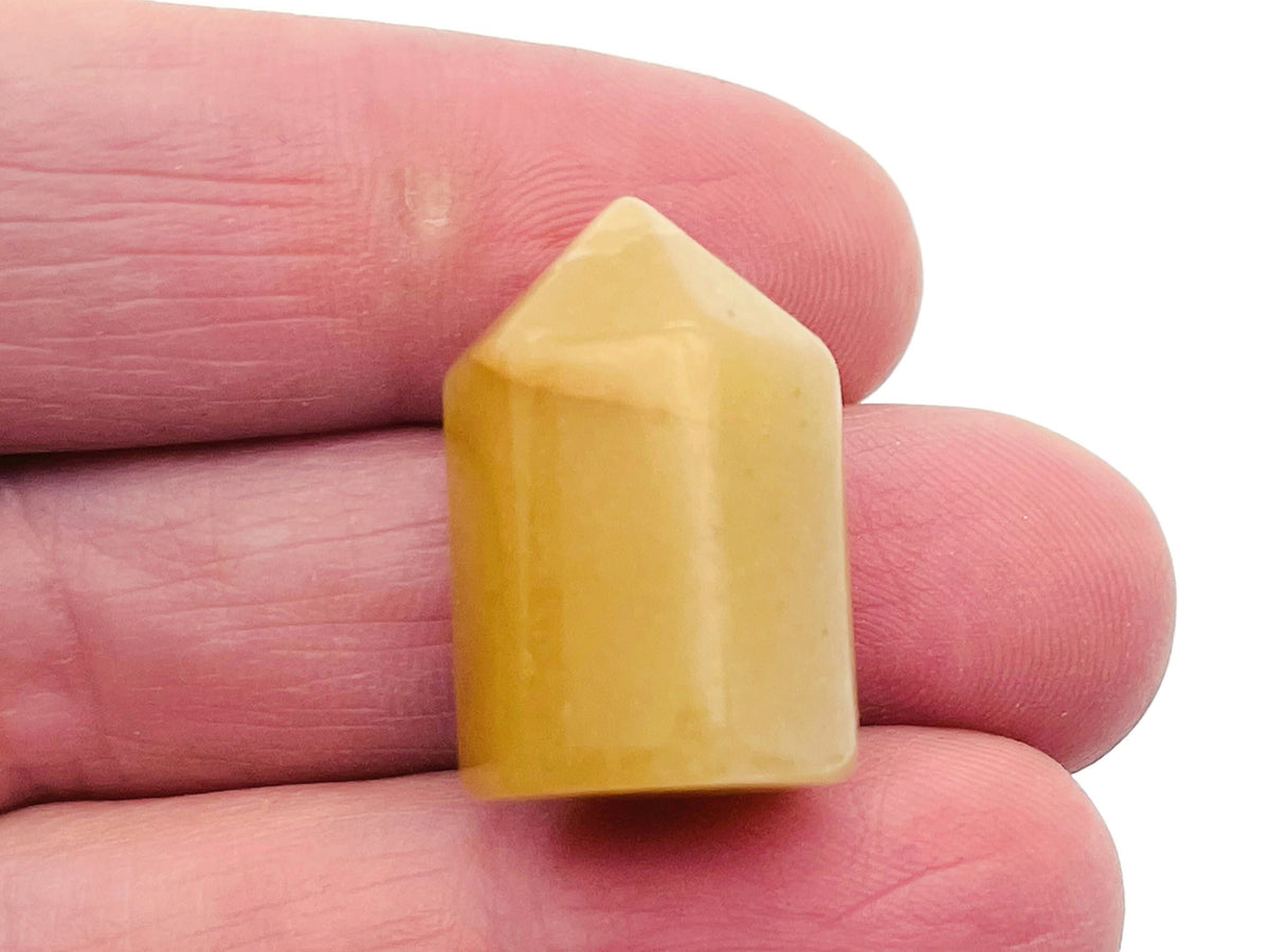 Yellow aventurine obelisk tower crystal, 25mm gemstone sculpture by GemstoneGO, featuring a polished yellow stone with natural striations.