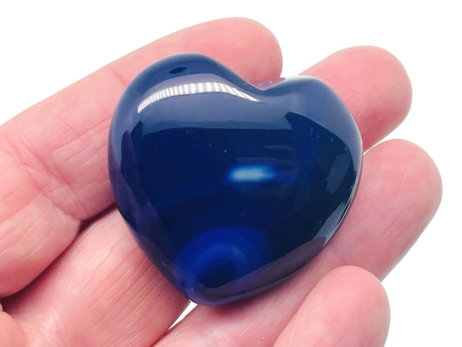 Blue Agate Heart-shaped gemstone, 40mm, from GemstoneGO, showcasing its vibrant blue color and smooth polished surface.