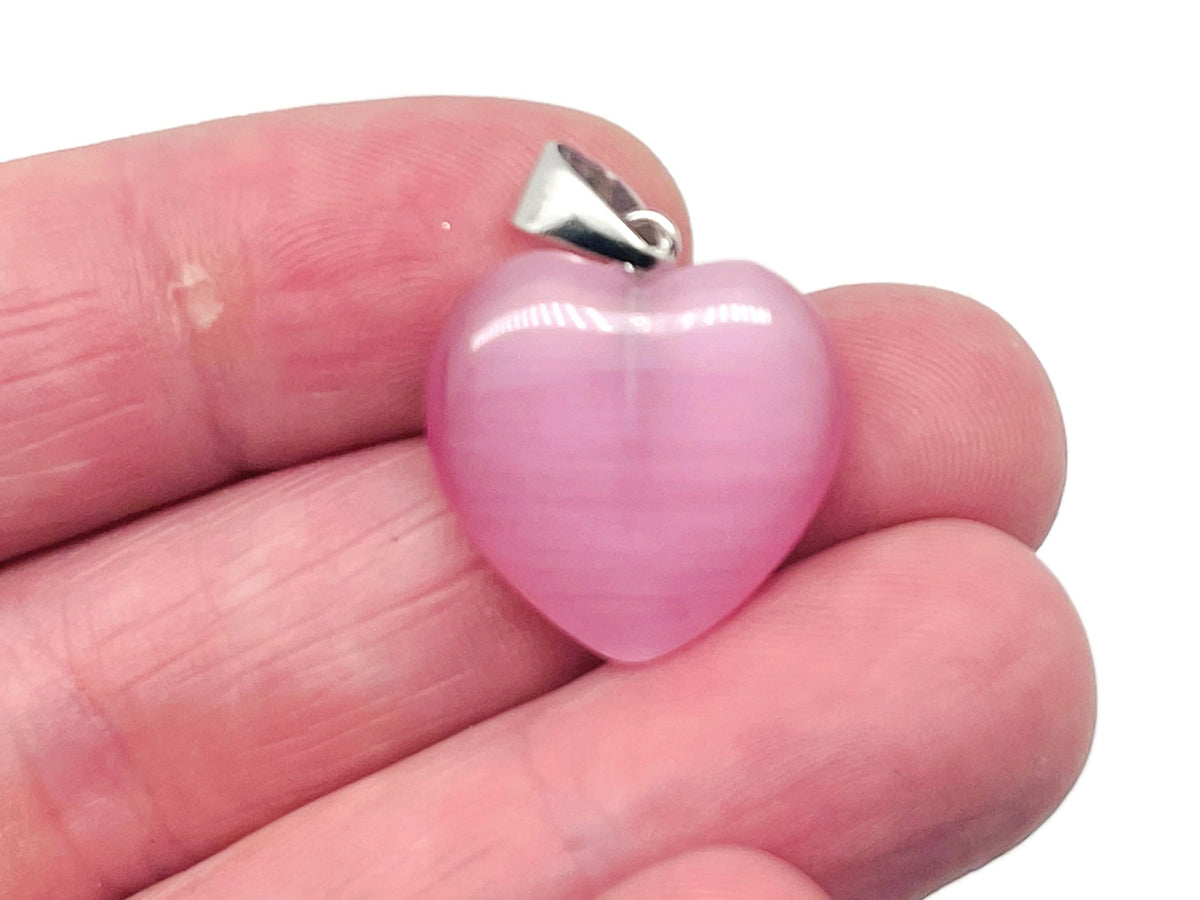 Pink cats eye heart pendant featuring crystals, gemstone healing jewelry by GemstoneGO, with a smooth polished surface and delicate chain.