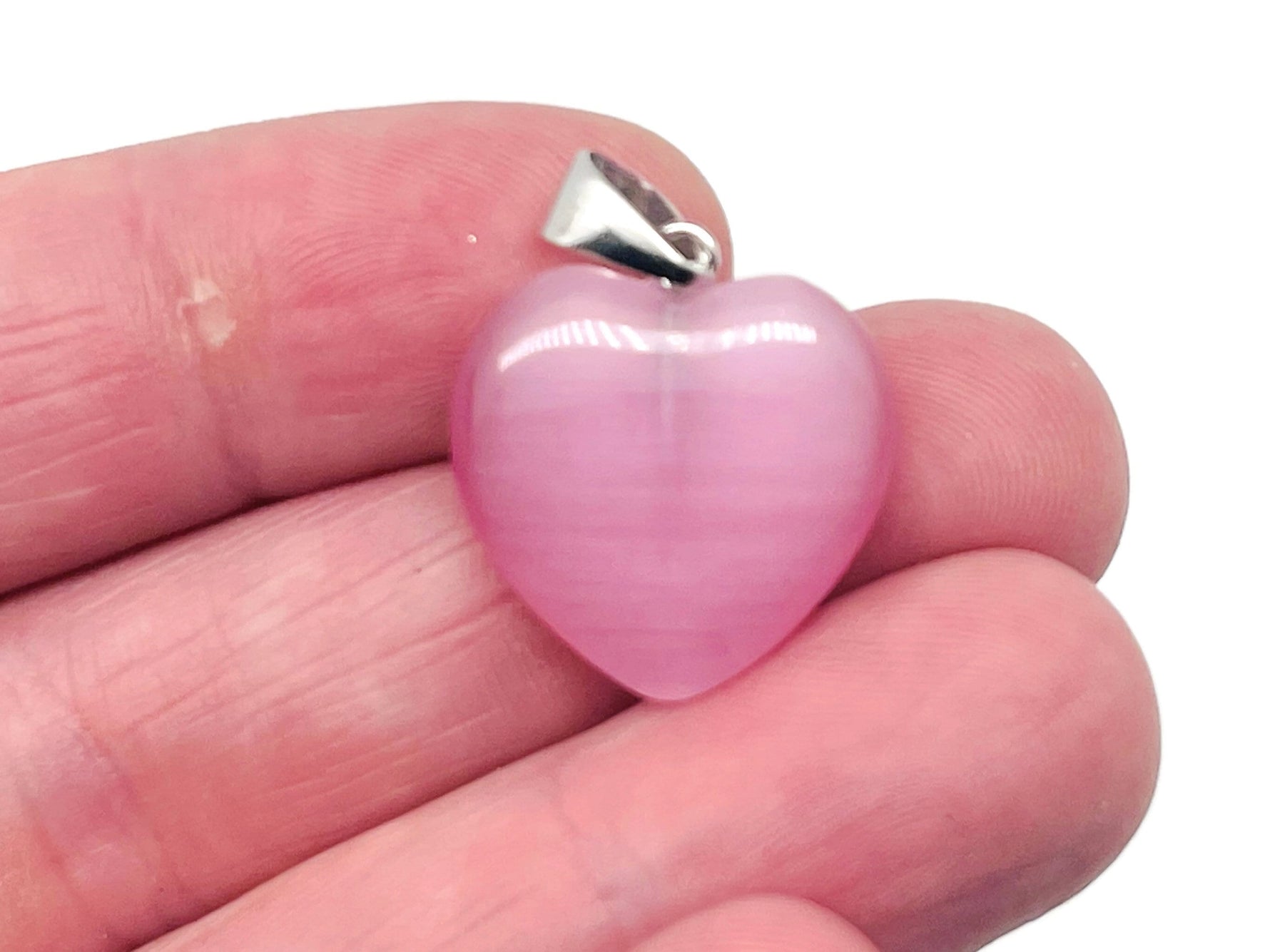 Pink cats eye heart pendant featuring crystals, gemstone healing jewelry by GemstoneGO, with a smooth polished surface and delicate chain.
