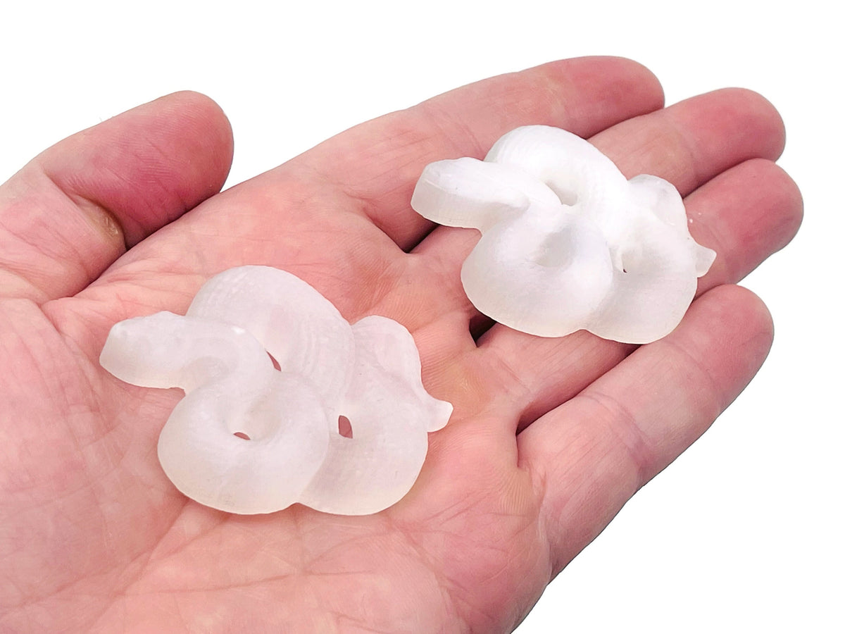 Selenite snake gemstone carving from GemstoneGO, detailed white stone sculpture of a snake, smooth polished surface and intricate design