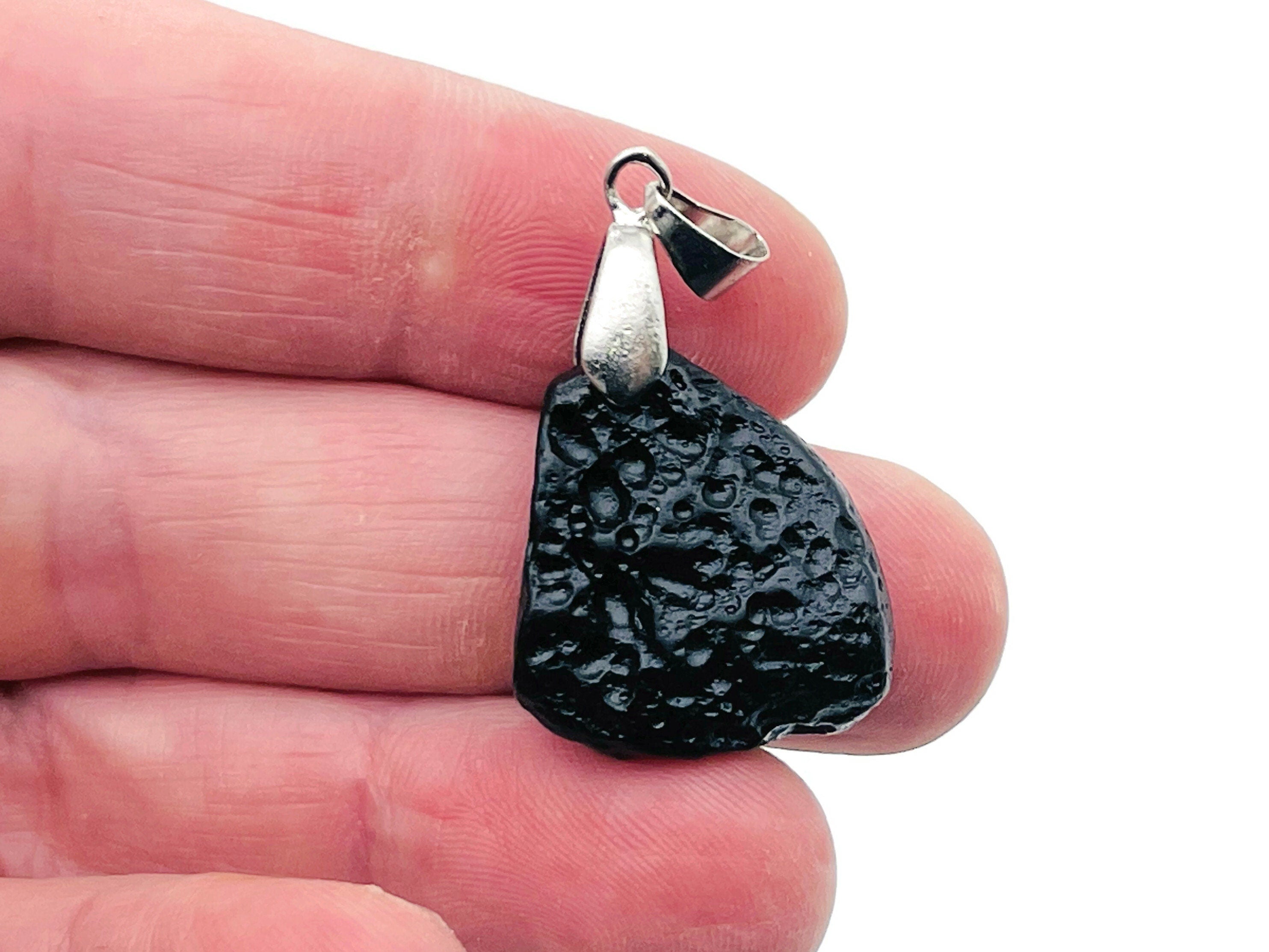 Tektite pendant with Tibetan tektike meteorite gemstone, handcrafted jewelry piece featuring natural stone and intricate design.