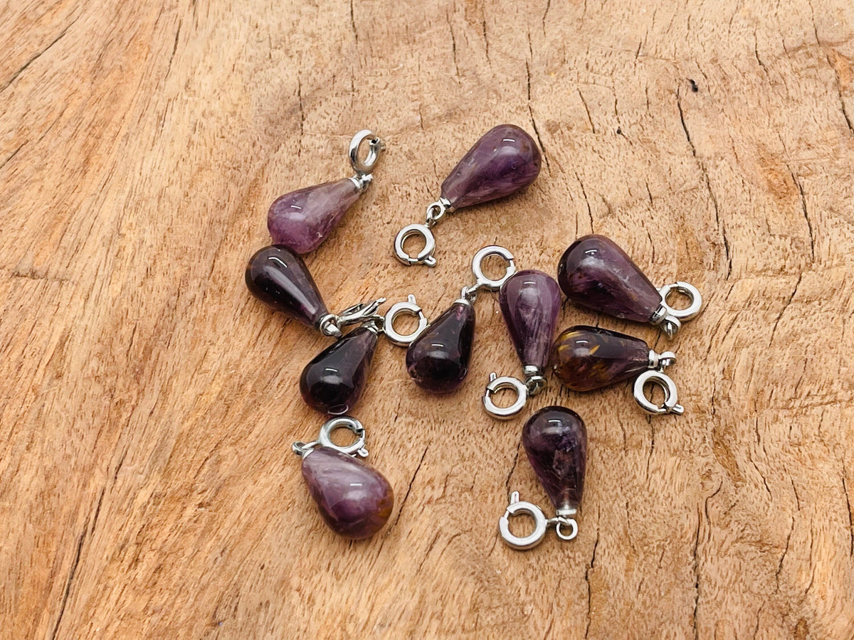 Super 7 crystal pendant from GemstoneGO, showcasing a sparkling gemstone pendant with intricate silver setting for jewelry making.