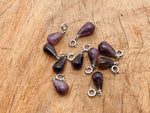 Super 7 crystal pendant from GemstoneGO, showcasing a sparkling gemstone pendant with intricate silver setting for jewelry making.