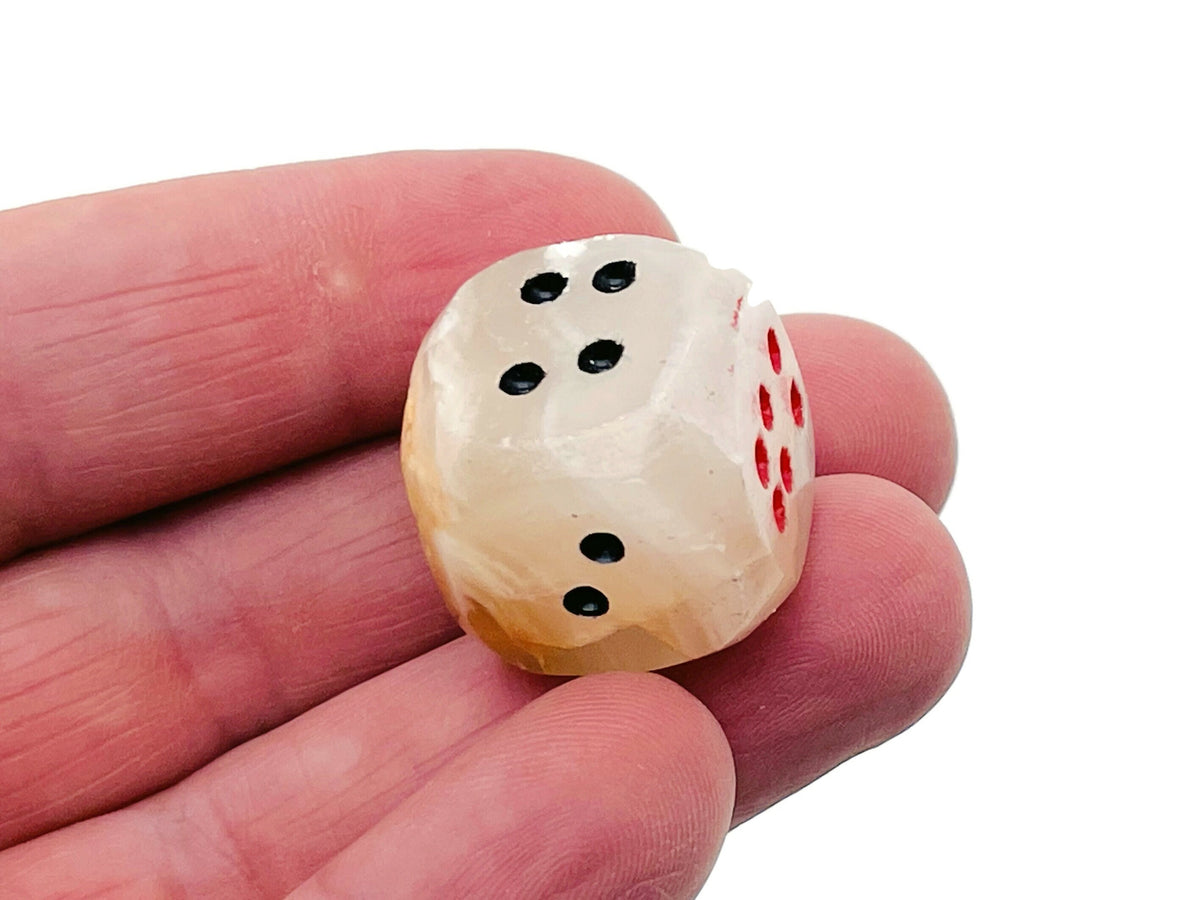 Carved Afghanistan Jade crystal dice from GemstoneGO featuring detailed gemstone craftsmanship and vibrant green hues.