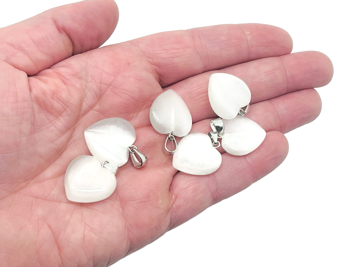 White cats eye heart pendant with crystals from GemstoneGO, featuring a mini healing gemstone jewelry design.