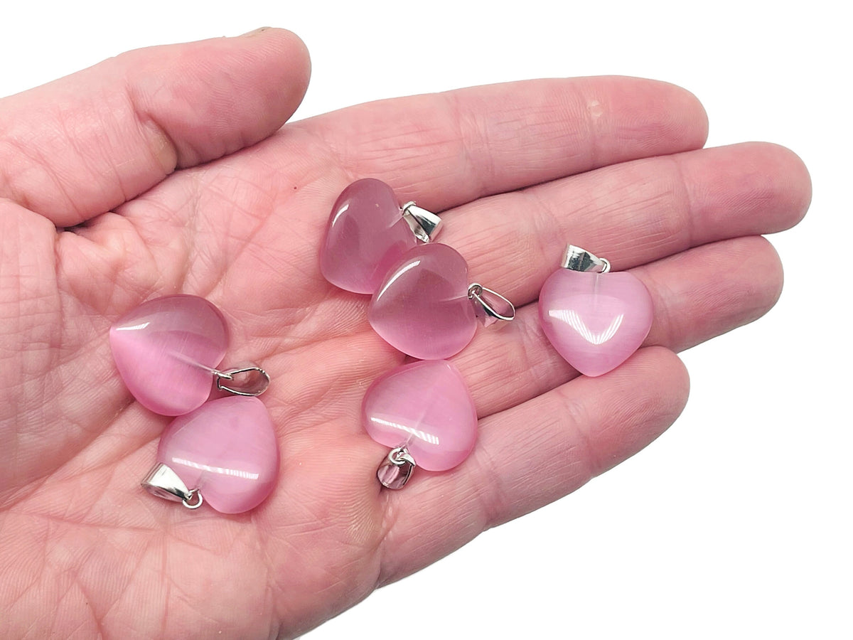 Pink cats eye heart pendant with crystal accents from GemstoneGO, showcasing a mini healing gemstone jewelry piece.