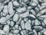 Black strawberry quartz crystal chips, semi-tumbled stones from GemstoneGO, 7-18mm, shown in bulk with smooth, polished surfaces.