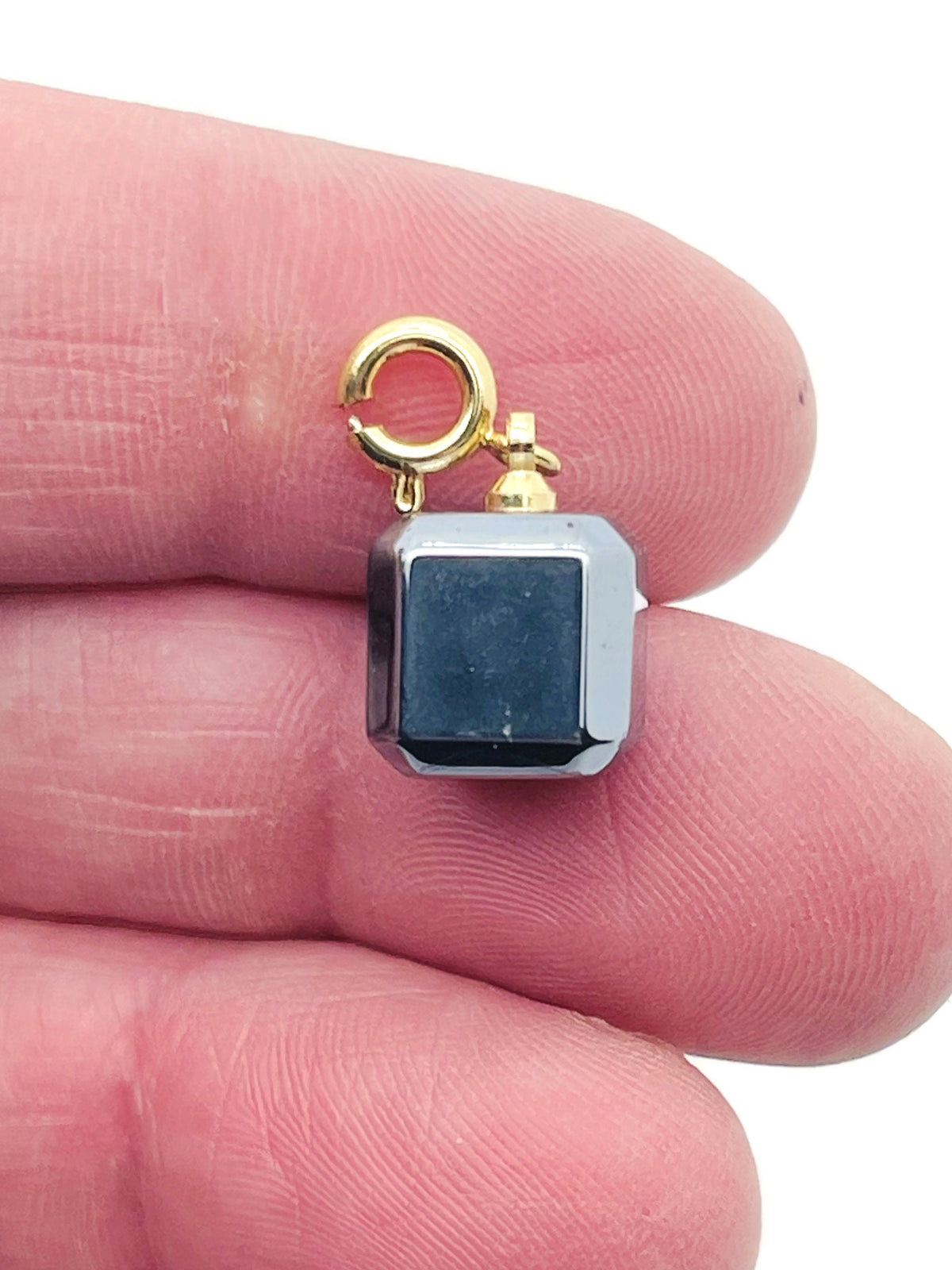 Terahertz Cube gemstone pendant from GemstoneGO, showcasing a polished, vibrant gemstone pendant for jewelry making.