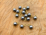 Terahertz ball gemstone pendant from GemstoneGO, featuring a polished round gemstone for jewelry making displays.