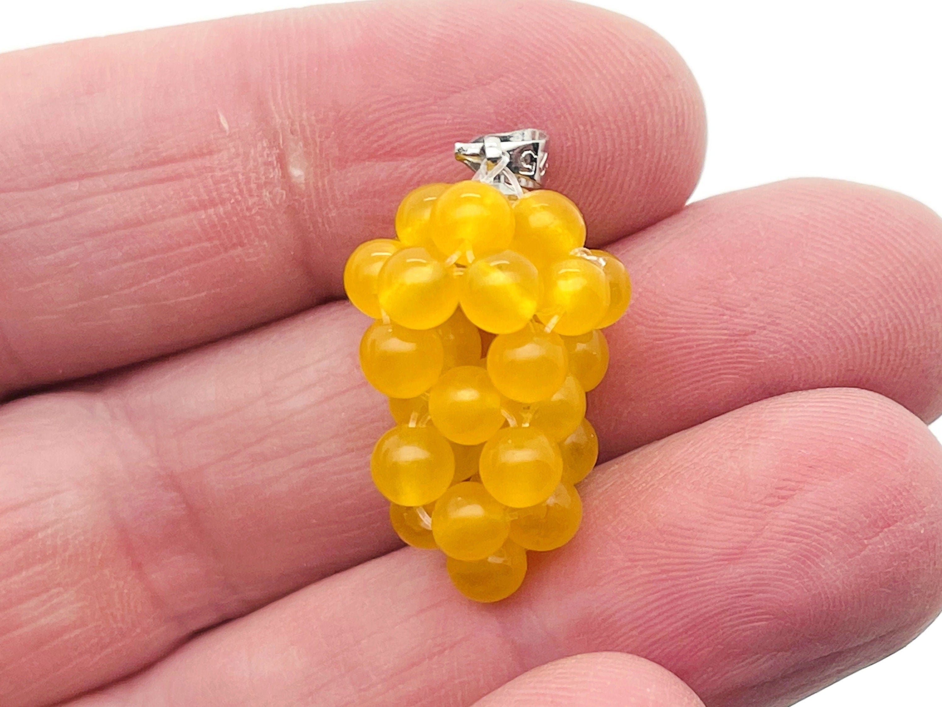 Yellow agate grape crystal pendant with a cluster of yellow crystal grapes, crafted by GemstoneGO.