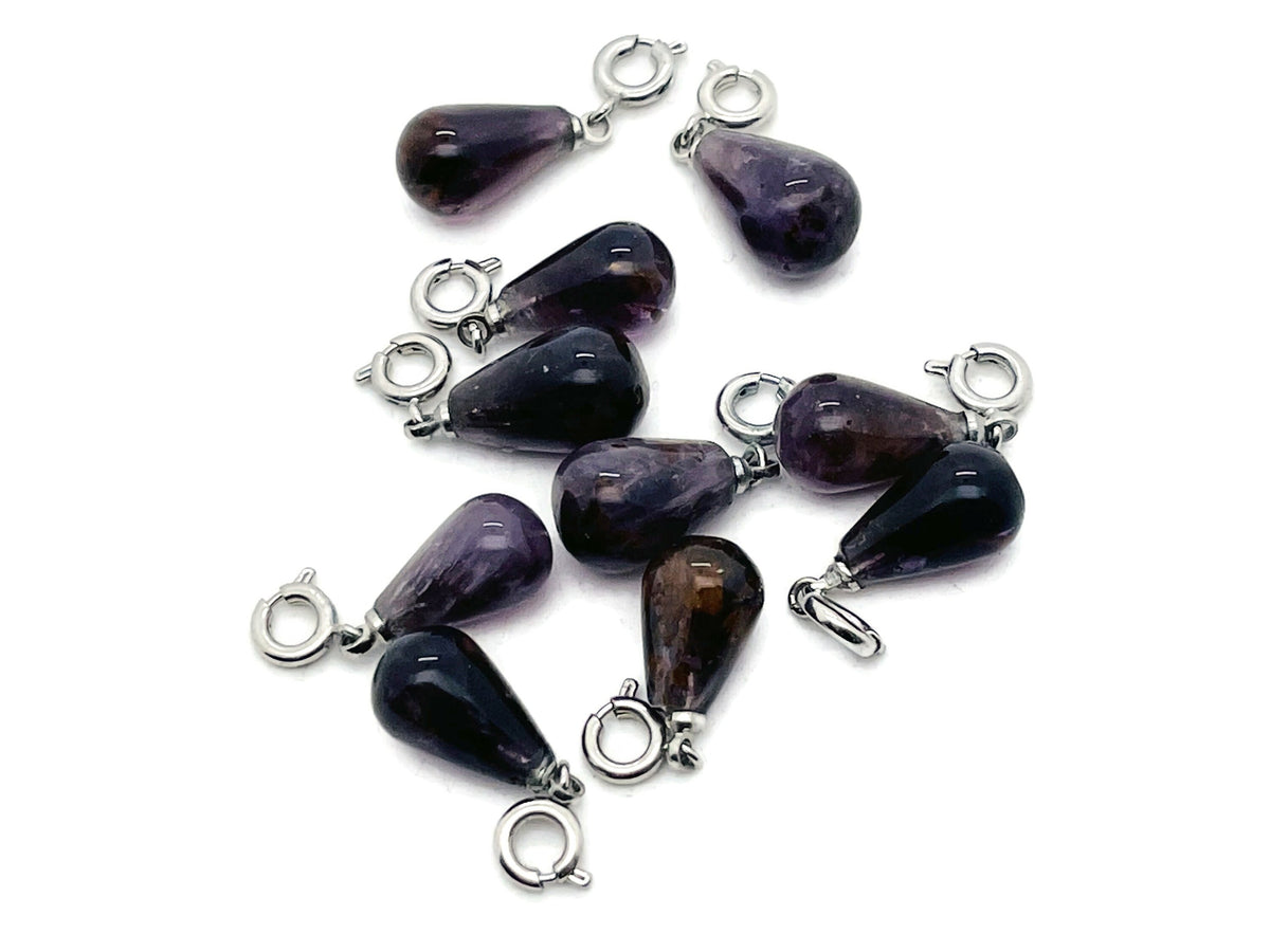 Super 7 crystal pendant from GemstoneGO, showcasing a sparkling, multi-colored gemstone pendant on a silver chain.