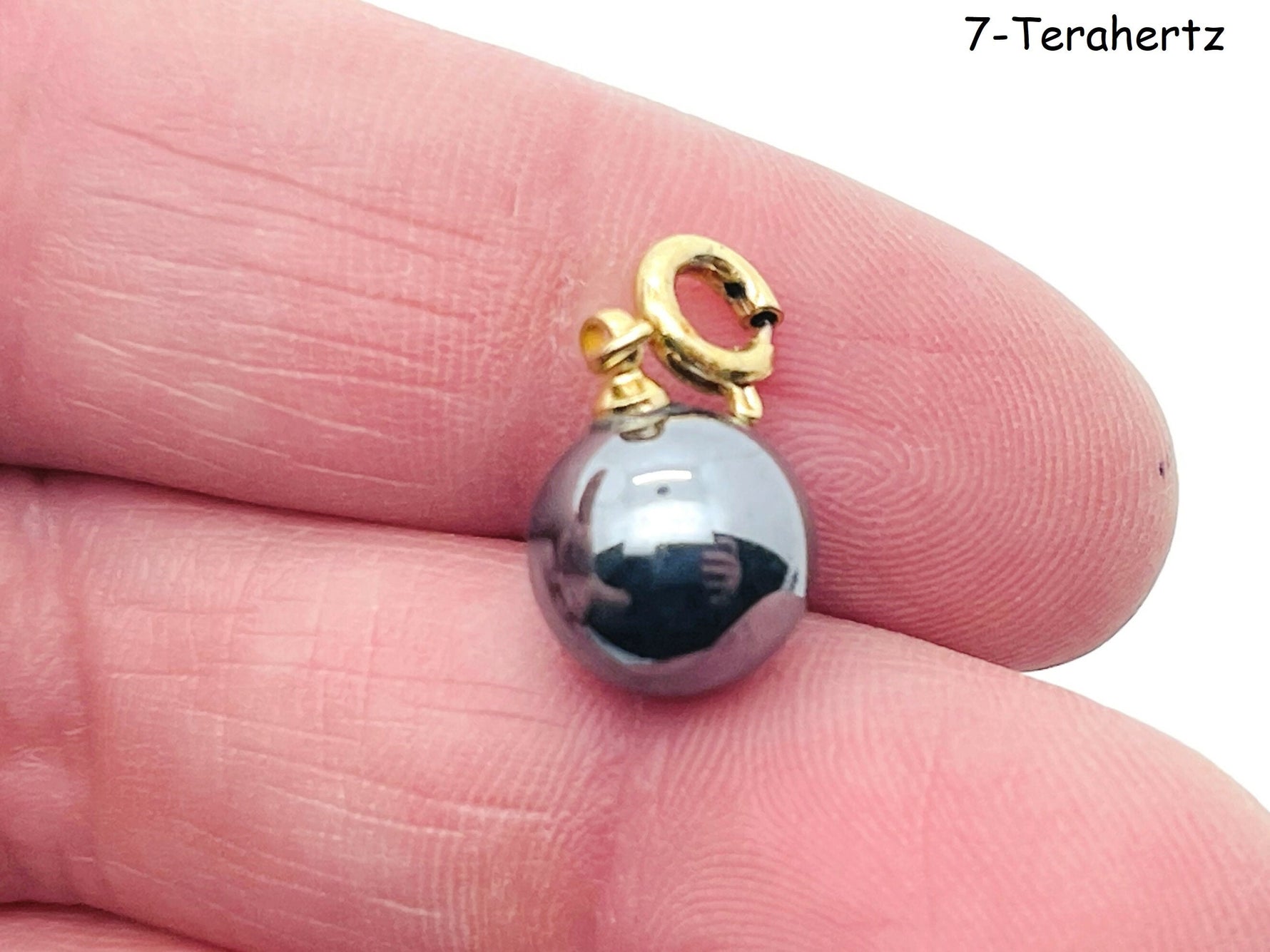 Terahertz gemstone pendant from GemstoneGO, showcasing a vibrant, polished gemstone in a jewelry-making design.