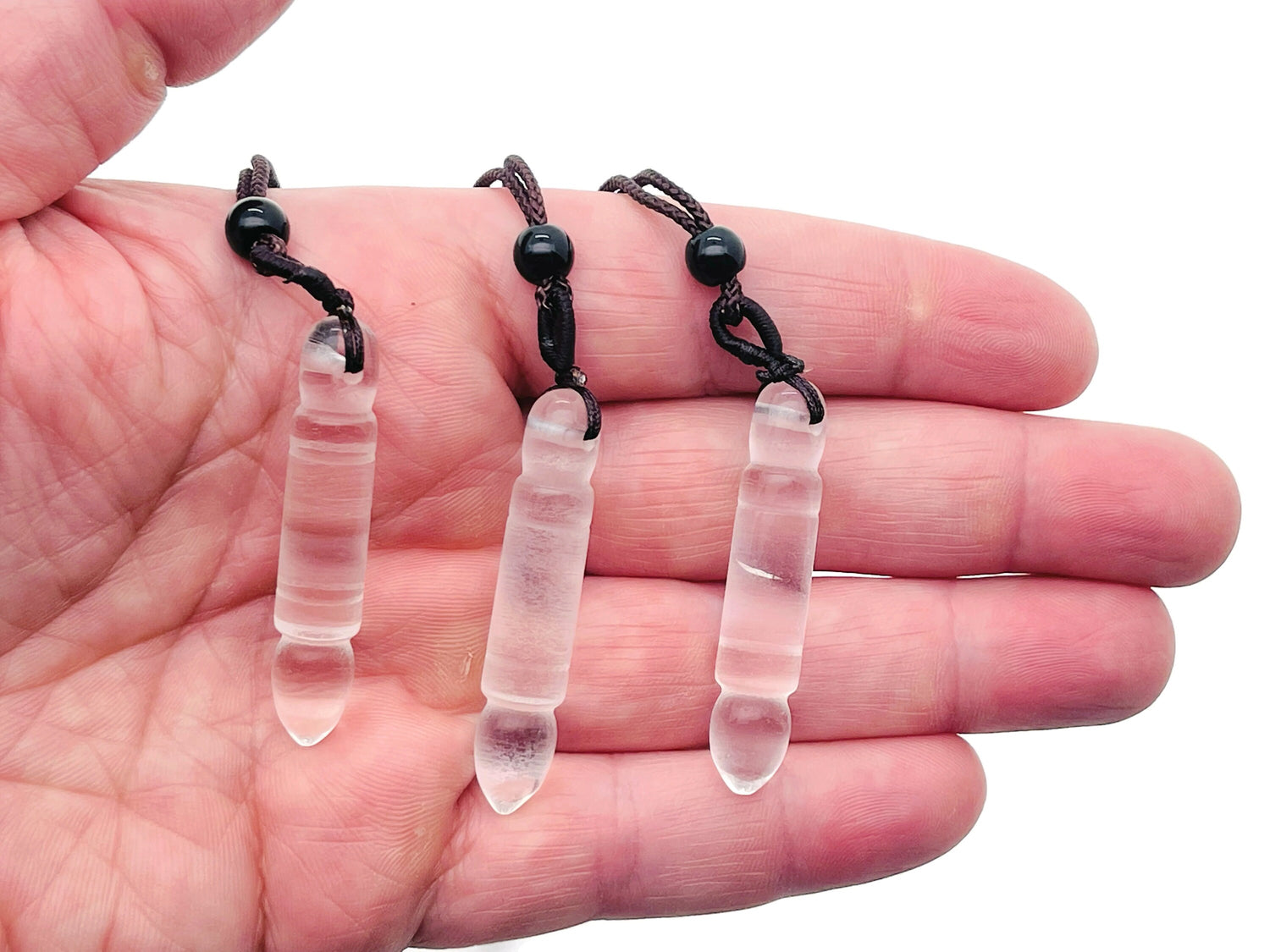 Clear quartz bullet crystal necklace from GemstoneGO featuring a sleek, polished quartz pendant on a delicate chain.