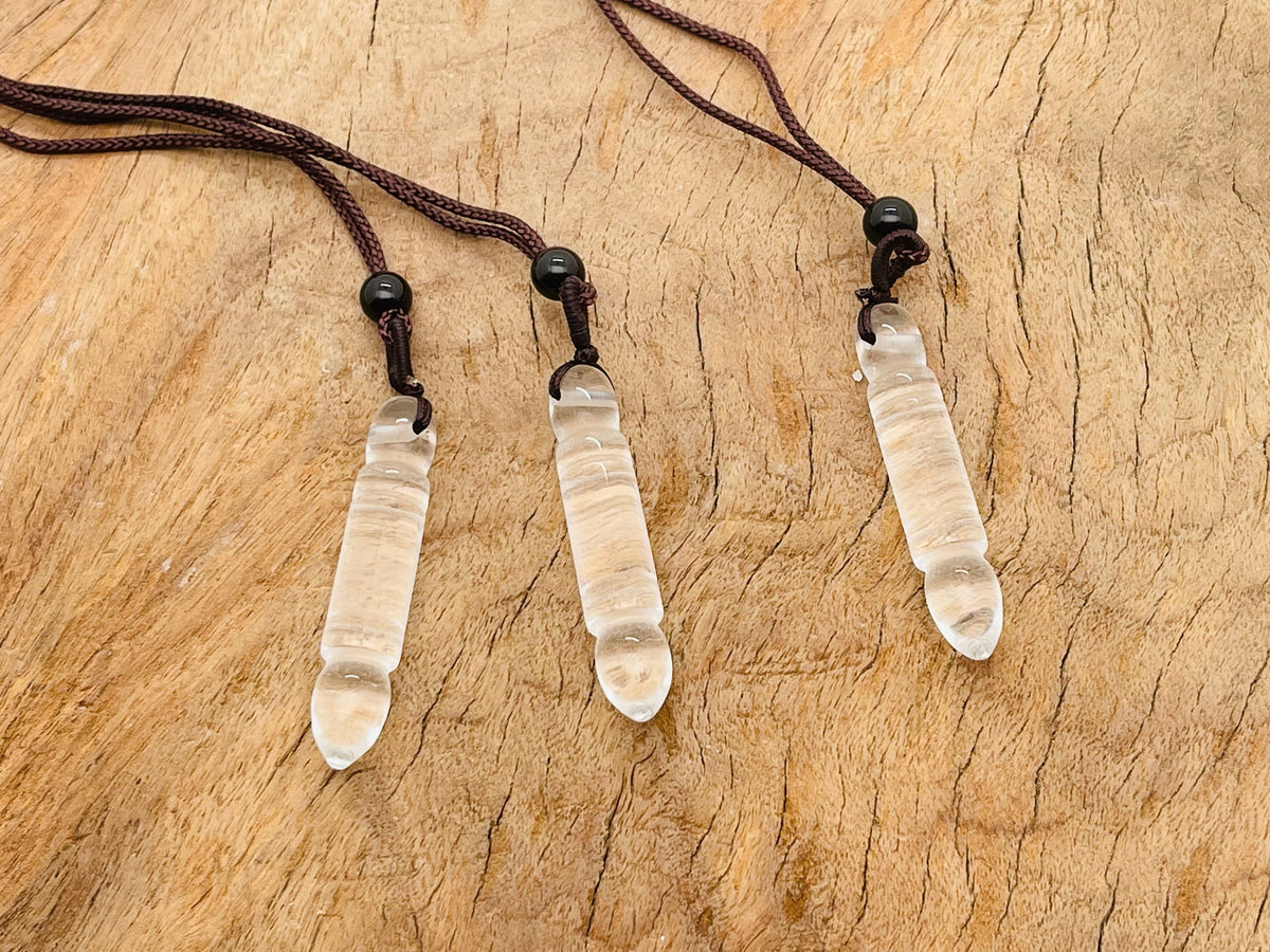 Clear Quartz bullet crystal necklace from GemstoneGO featuring a sleek, polished pendant on a delicate chain.