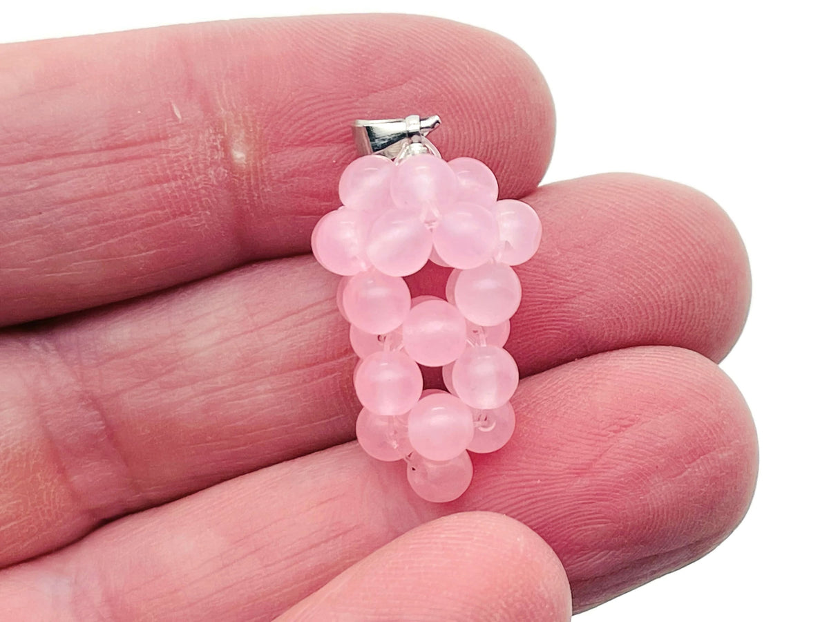 Rose quartz grape crystal pendant from GemstoneGO featuring a detailed grape cluster design with pink quartz stones.